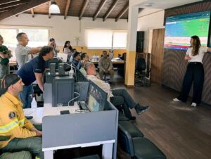 Emergency response personnel observe a demonstration of OroraTech’s real-time wildfire intelligence platform - Firebuyer.com
